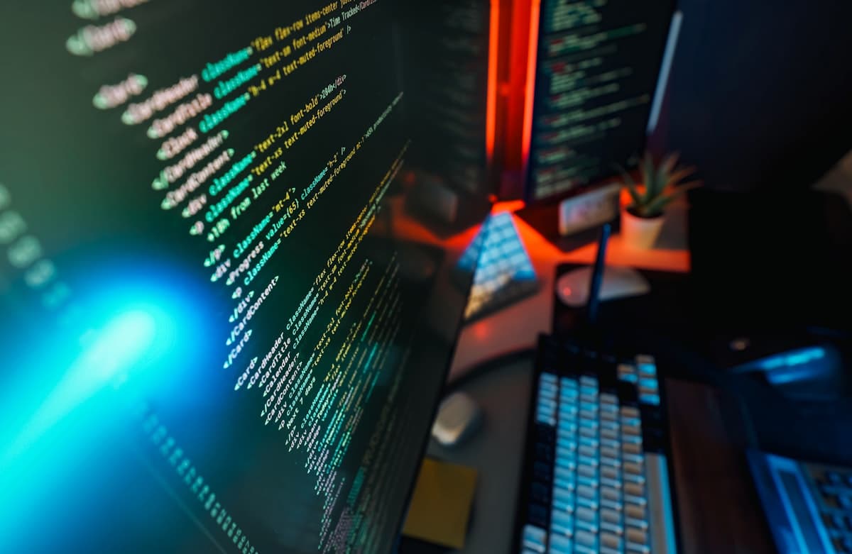 Close-up of code and automation dashboards on screen